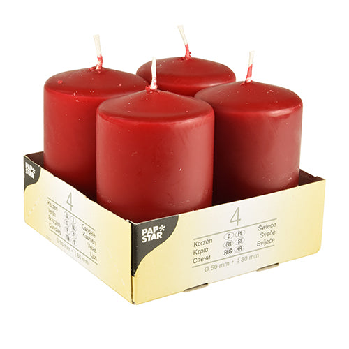 Vier elfenbeinfarbene Starpak Stumpenkerzen (Ø 50 mm, 80 mm, Flachkopf) stehen aufrecht in einem beigen Kartonhalter mit der Aufschrift „Starpak“. Die Packung zeigt Produktdetails, die Menge 4 und betont die Verwendung von hochwertigem Wachs.