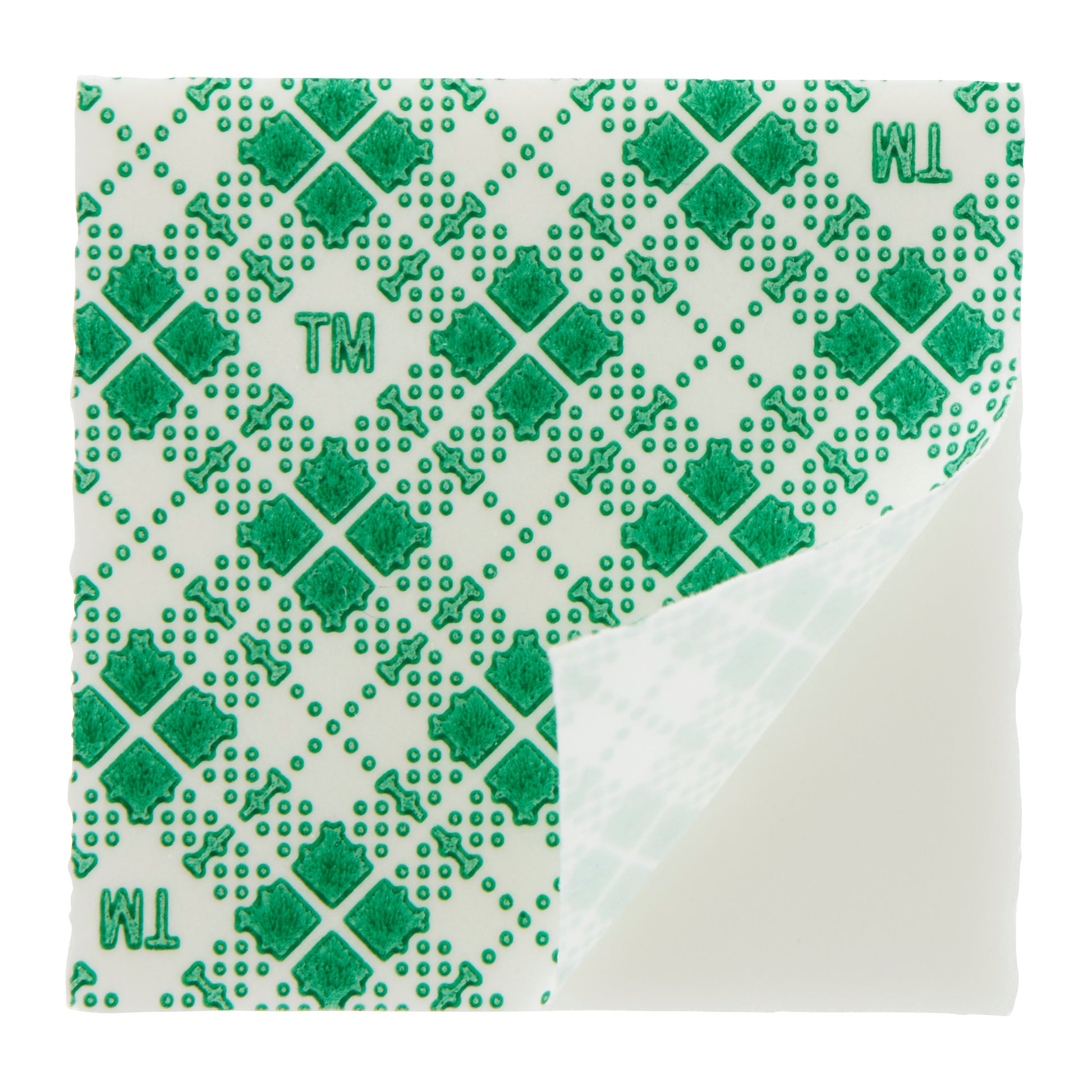 Ein 25 mm x 25 mm großes, quadratisches, doppelseitiges Scotch-FIX™-Klebepad (3M Deutschland GmbH) mit durchsichtiger Oberfläche und grünem, geometrischem "TM"-Aufdruck, bei dem eine Ecke gefaltet ist, um die glatte Unterseite freizulegen.