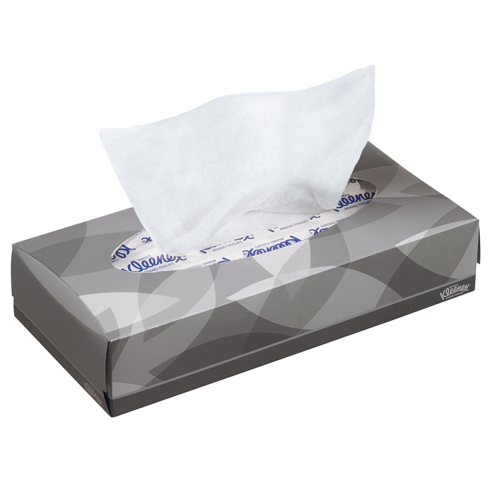 Eine rechteckige graue Schachtel mit Kleenex® Kosmetiktüchern - Standard / Weiß von Kimberly-Clark GmbH, aus der ein einzelnes weißes Taschentuch herausgezogen ist. Dezentes Blattmuster und Markentext. Ideal für Make-up-Entfernung oder Gesichtsreinigung.