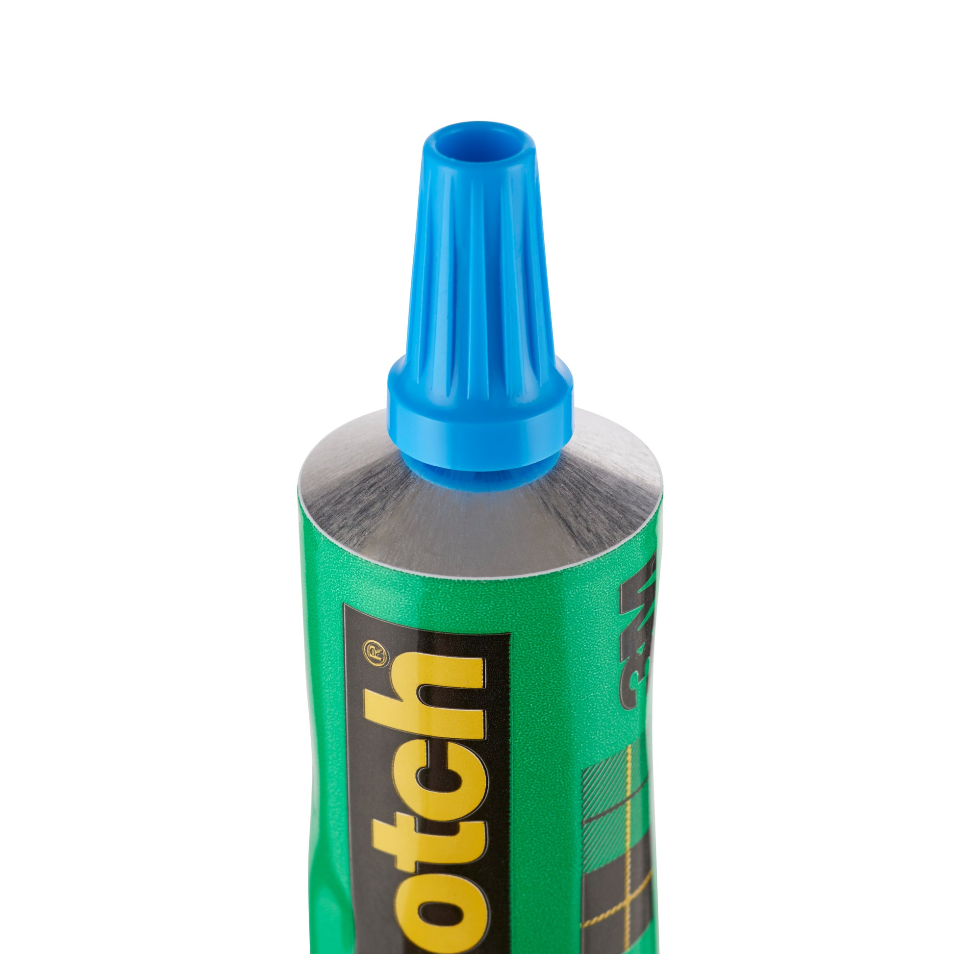 Nahaufnahme der geöffneten Spitze einer grünen 3M Deutschland GmbH Scotch® transparenter lösemittelfreier Kleber (30 ml) Tube mit blauer Kappe, die aufrecht auf ihrer silbernen Tülle steht.