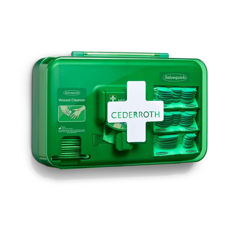 Ein blauer Orkla Wound Care AB Wundversorgungsspender (1 Packung), der an der Wand montiert wird, enthält Fächer mit Wundreinigungstüchern und Klebebinden. Das Gerät ist zur einfachen Identifizierung mit einem weißen Kreuzsymbol versehen.