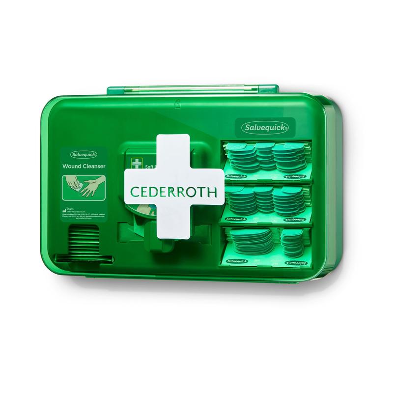 Ein blauer Orkla Wound Care AB Wundversorgungsspender (1 Packung), montiert an einer weißen Wand, mit mehreren Fächern für Salvequick Wundreinigungstücher und Pflaster.