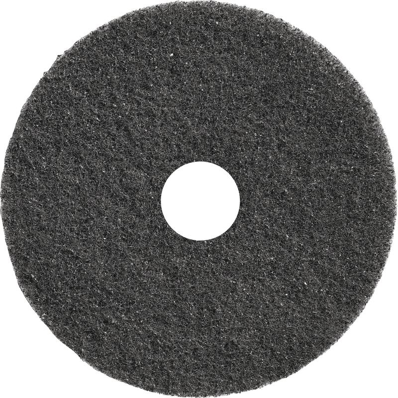 Ein rundes, schwarzes TASKI Americo Dominator Pad 17" (43 cm) von Diversey Deutschland GmbH & Co. OHG mit rauer Textur und Mittelloch - ein extra aggressives Grundreinigungspad, ideal für die intensive Bodenreinigung (Packung: 1 Stück).