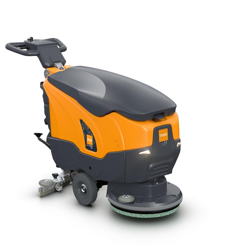 Eine orange-schwarze TASKI ULTIMAXX 900 SD43 P BMS 13A gel ready Bodenreinigungsmaschine von Diversey Deutschland GmbH & Co. OHG, mit Handgriff, Bedienfeld, großen Rädern, kreisförmigem Scheuerpad vorne und sichtbarem "TASKI"-Schriftzug.