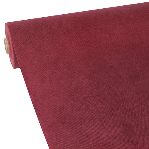 Eine Rolle Starpak Tischdecke, stoffähnlich, Vlies „Soft Selection“ von Starpak ist teilweise schräg auf einem schlichten weißen Hintergrund ausgerollt und zeigt ihre glatte, samtige Textur in tiefem Rot.