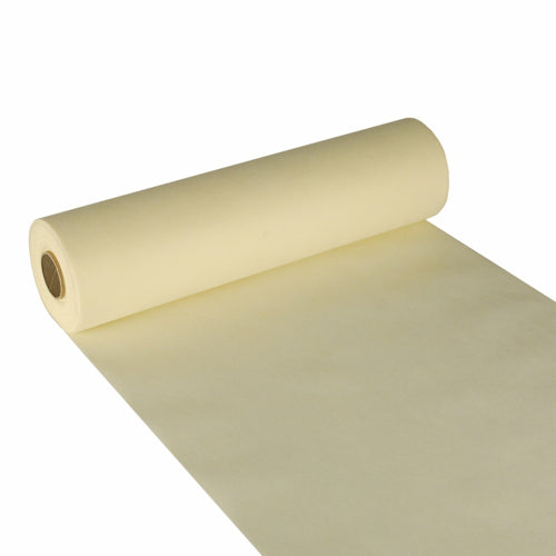 Der Starpak Tischläufer, stoffähnlich Vlies „soft selection“ (24 m x 40 cm), in Zartgelb ist hier teilweise ausgerollt mit sichtbarer Innenröhre abgebildet – perfekt als eleganter Tischläufer für stilvolle Ambiente.