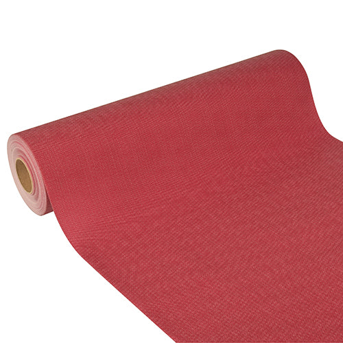 Der Starpak Tischläufer aus stoffähnlichem Vlies „Soft Selection Plus“ (24 m x 40 cm) ist teilweise auf weißem Hintergrund zu sehen – seine leicht raue Textur und diagonale Ausrichtung verleihen dem Bild Eleganz.