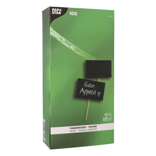 Eine grüne "PAPSTAR 100 Fingerfood - Picker"-Box der PAPSTAR GmbH, die zwei Bambuspicker mit beschreibbaren Tafeldeko-Schildern zeigt - auf einem steht "Guten Appetit" mit einem Herz.