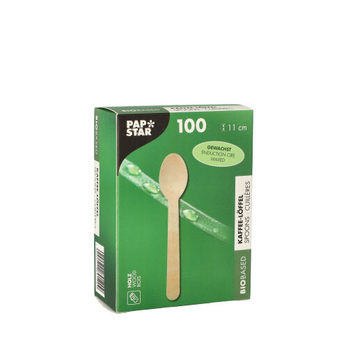 Eine grüne PAPSTAR-Box enthält 100 „reine“ Kaffeelöffel aus Holz, jeweils 11 cm lang und gewachst. Die Box zeigt einen Holzlöffel und Wassertropfen auf einem grünen Blatt.