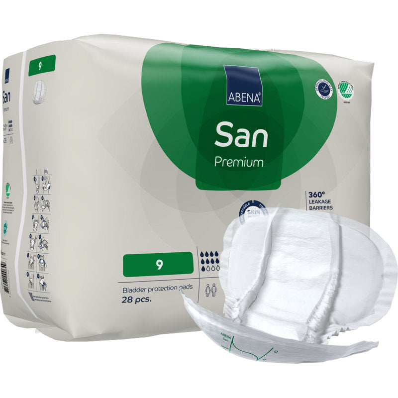 Eine beigefarbene Packung mit grünen und weißen Akzenten zeigt "ABENA San Premium" von Abena Re-Seller GmbH. Auf der Vorderseite steht "9", hohe Saugfähigkeit, 28 Stück innen, und vorne ist ein Pad abgebildet.