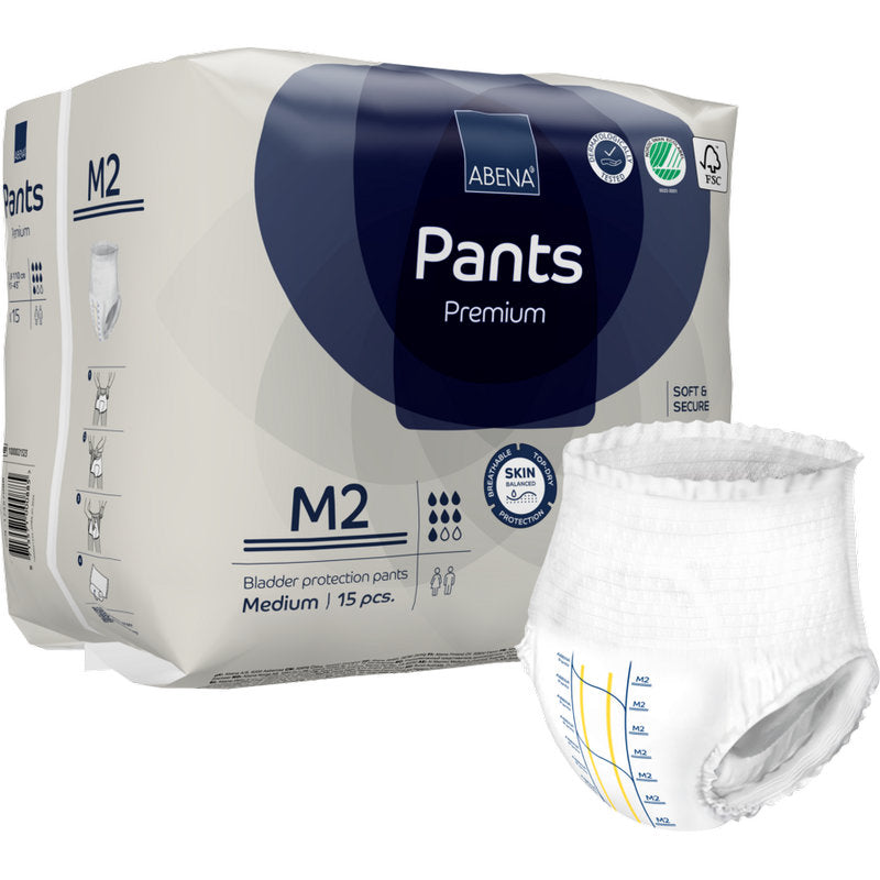 Eine Packung ABENA Pants Premium M von Abena Re-Seller GmbH enthält 15 Stück. Außerhalb der Verpackung ist eine Einweghose abgebildet, die mit Messlinien versehen ist und ihre hohe Saugfähigkeit unterstreicht.