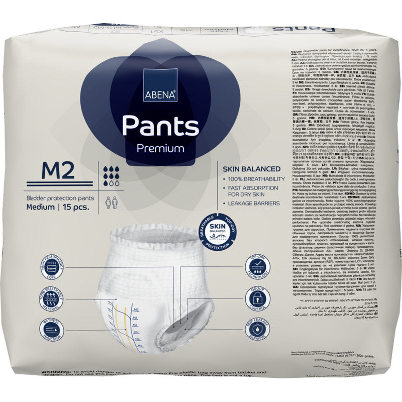 Eine Packung mit 15 ABENA Pants Premium M von Abena Re-Seller GmbH, mittelgroße Einweghosen mit hoher Saugfähigkeit. Auf der Verpackung sind Produktdetails, Icons und Bilder in mehreren Sprachen abgebildet.