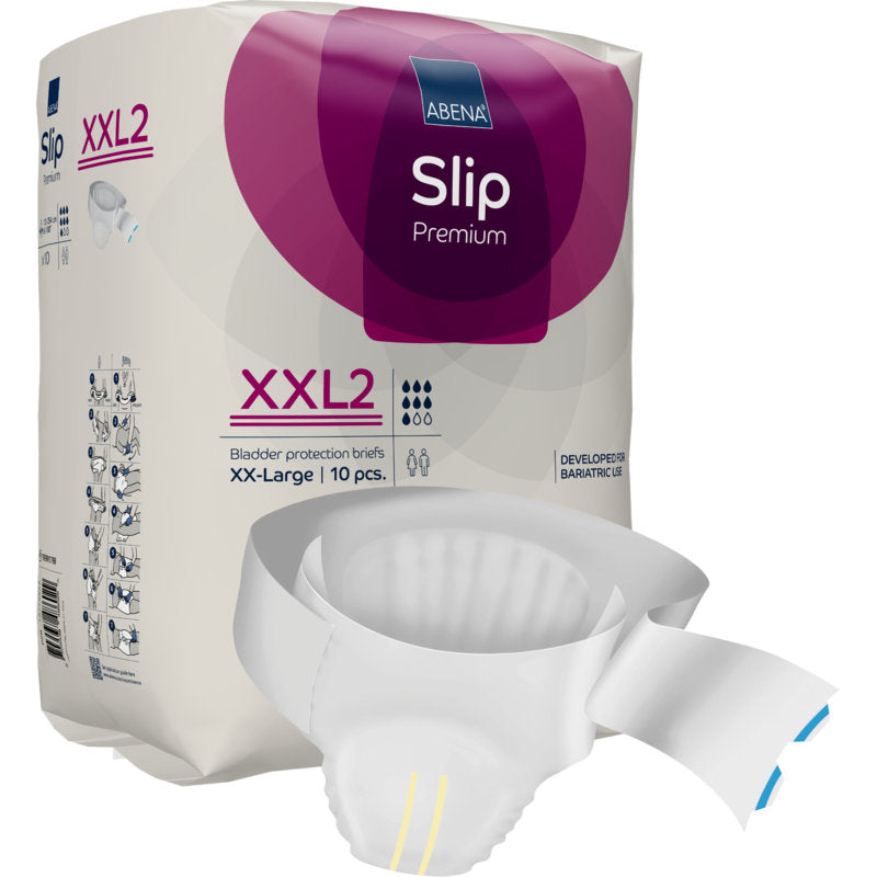 Eine Packung ABENA Slip Premium der Abena Re-Seller GmbH ist ausgestellt, ein teilweise ausgepackter Slip liegt davor. Die lila-weiße Packung betont die Größe XX-Large, 10 Stück, und die zuverlässige Inkontinenzversorgung.