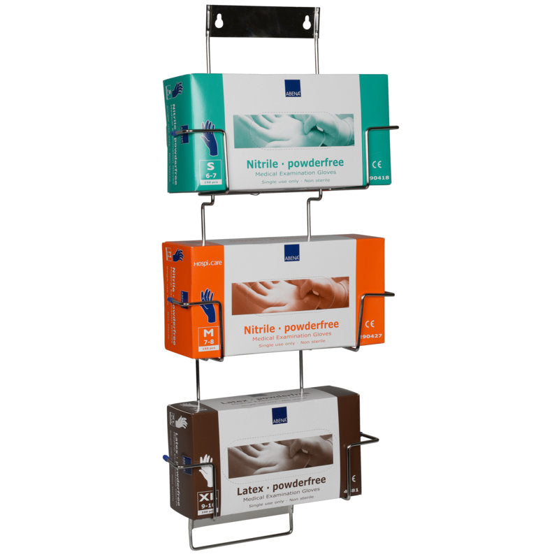 Das Flexi Rack von Abena Re-Seller GmbH ist ein dreistufiger Metall-Wandhalter für Handschuhboxen, in dem grüne kleine Nitril-, orange mittelgroße Nitril- und braune extragroße Latex-Handschuhboxen vertikal präsentiert werden.