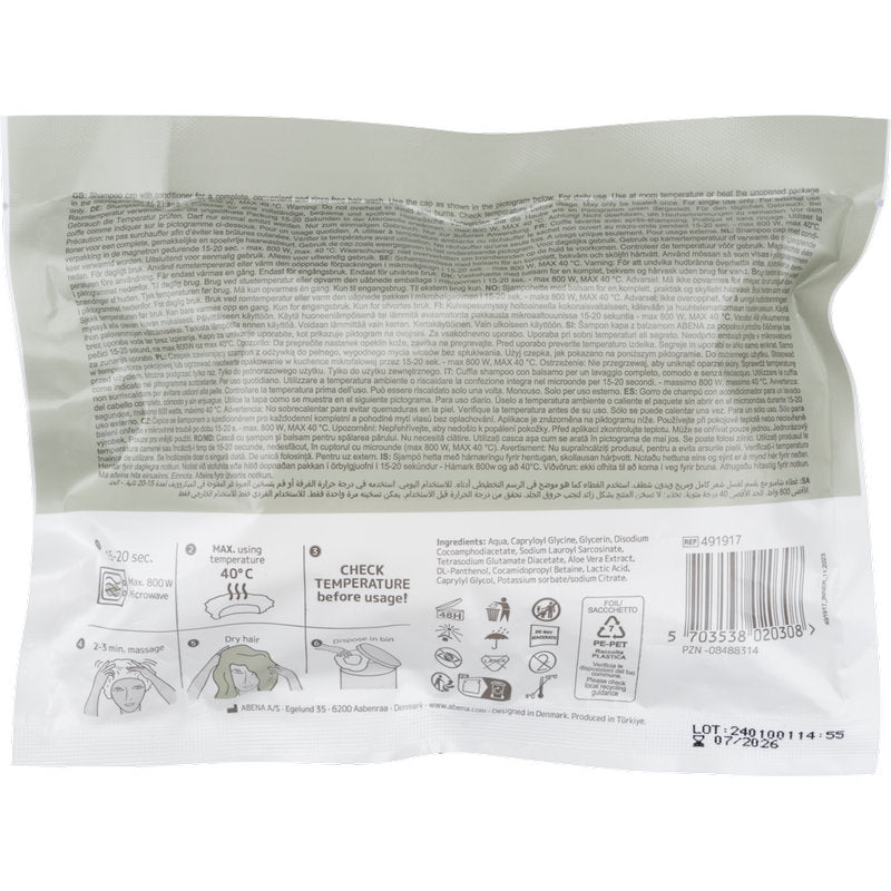 Eine versiegelte weiße Kunststoffverpackung (ø 32 cm) für Abena Re-Seller GmbH Shampoo-Haube zeigt Gebrauchsanweisung, Piktogramme, Barcode, Inhaltsstoffe und Temperaturhinweise in mehreren Sprachen. Das Design passt zur Einweg-Haube; die Schachtel enthält 30 Packungen.