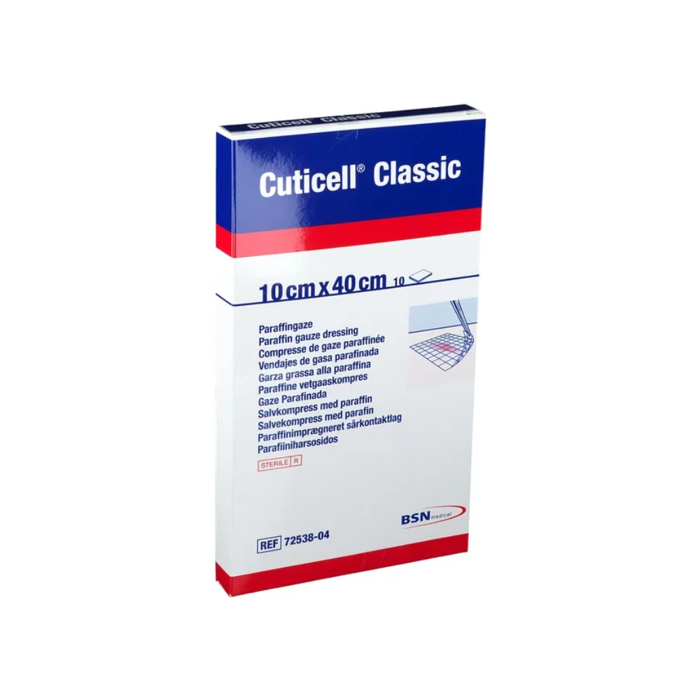 Das Bild zeigt eine Packung BSN Cuticell® Classic sterile Salbenkompresse mit Paraffin von BSN Medical GmbH. Die Verpackung ist weiß mit blauem und rotem Text, misst 10 cm x 40 cm und enthält mehrsprachige Beschreibungen sowie das BSN Medical-Logo, wodurch sie ideal für die Wundversorgung ist.