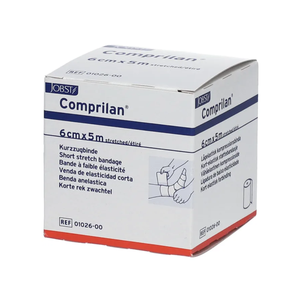 Das Bild zeigt eine Schachtel BSN Comprilan® elastische Binde, eine Kompressionsbinde der BSN Medical GmbH, mit den Abmessungen 6 cm x 5 m. Die Verpackung enthält mehrsprachige Informationen und eine Abbildung, die das Anlegen der Binde an einem Bein demonstriert.