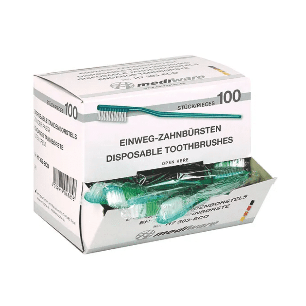 Eine Schachtel mit 100 Einmalzahnbürsten der Servoprax GmbH, beschriftet in Englisch und Deutsch. Die teilweise geöffnete Verpackung zeigt mehrere grüne Zahnbürsten im Inneren, auf denen der Produktname „Mediware Einmal-Zahnbürste ohne Zahnpulver grün – 100 Stück“ zu sehen ist.