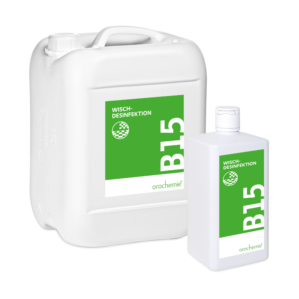 Zwei weiße Behälter - ein großer Kanister, eine kleinere Flasche - tragen grün-weiße Etiketten mit der Aufschrift "Orochemie B 15 Wischdesinfektion" der orochemie GmbH + Co KG, ein gegen alle Viren wirksames Konzentrat zur Flächendesinfektion.