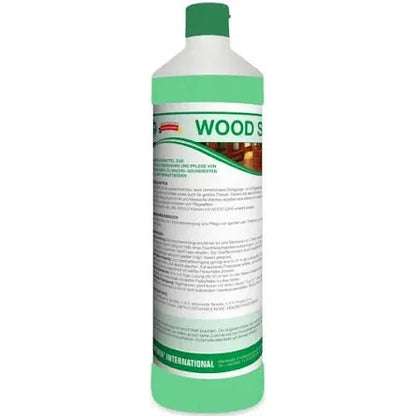 Standing upright is a tall bottle of Arcora WOOD SAFE WISCHPFLEGE from Arcora International GmbH, whose German-language label shows wood surfaces and indicates that it is intended for cleaning and care of oiled or oil/wax treated wood and parquet floors.