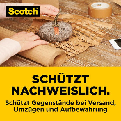A small decorative pumpkin is safely wrapped in Scotch™ Cushion Lock™ protective packaging (30.4 cm x 9.14 m) from 3M Deutschland GmbH. Tape and bubble wrap are on the table.