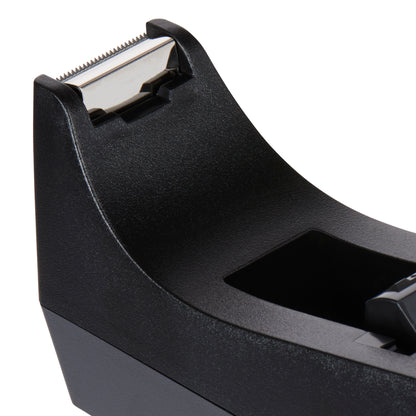 Close-up of the Scotch™ Desktop Tape Dispenser C38 in Black from 3M Deutschland GmbH, with a metal cutting blade and matte finish - perfect as office equipment.