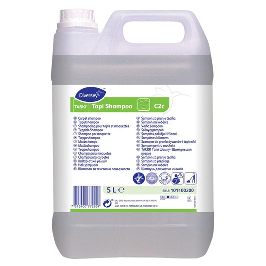 Ein 5-Liter-Kanister TASKI Tapi Shampoo von Diversey Deutschland GmbH & Co. OHG: neutrales Teppichshampoo mit Wollsiegel-Zertifizierung und O.N.T.-Technologie für dauerhafte Frische, mit weißem Etikett, Griff und Schraubverschluss.