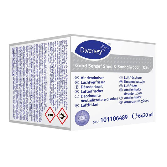 Eine weiß-lila Schachtel mit der Aufschrift "Good Sense Shea & Sandalwood, Duftpatrone für das Good Sense Lufterfrischersystem" von Diversey Deutschland GmbH & Co. OHG enthält 6 Kartuschen (6x20 ml) mit mehrsprachigen Angaben und Gefahrenwarnungen.