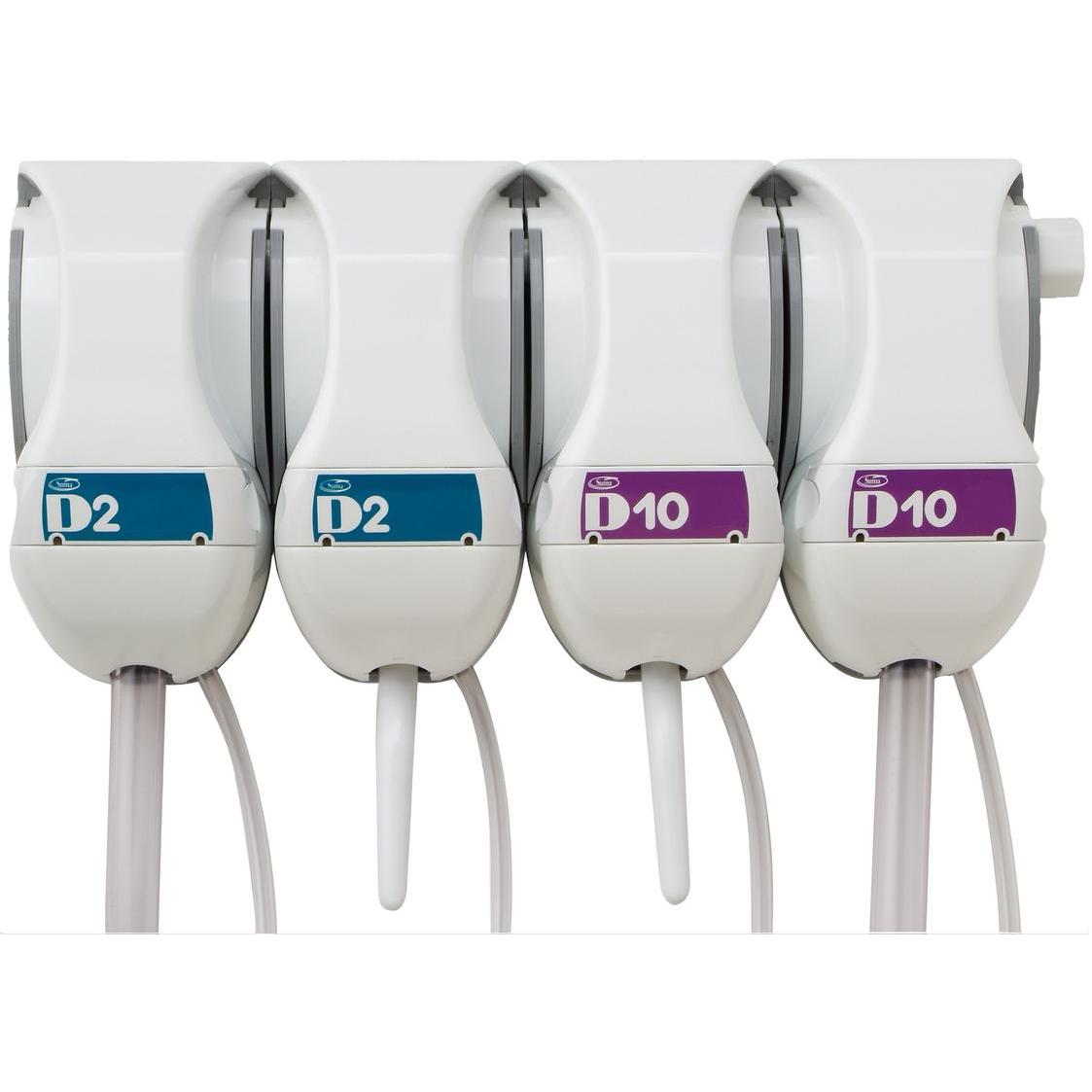 Four white QFM dosing stations from Diversey Deutschland GmbH & Co. OHG are mounted side by side on the wall, each labeled "D2" (blue) or "D10" (purple) and equipped with a nozzle and a hose for precise mixing of cleaning and disinfecting solutions.