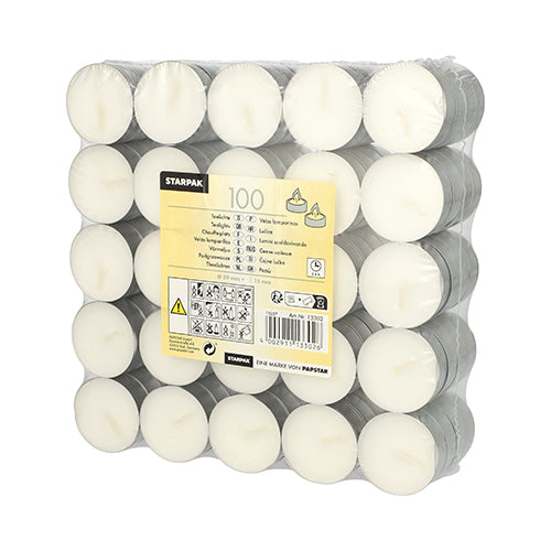 A pack of 100 white Starpak tealights (Ø 39 mm, 15 mm) in silver holders, stacked in five rows and wrapped in shrink wrap, with a yellow label containing product information and safety symbols on the front.
