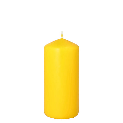 A solid yellow pillar candle (Ø 60 mm, 130 mm) from PAPSTAR GmbH with a rounded tip and a single, unlit wick stands upright against a plain white background.