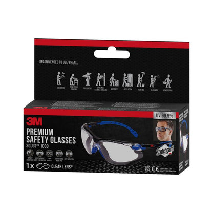 Pictured is a box of 3M™ Solus™ Safety Glasses 1000 with clear lenses, Scotchgard™ Anti-Fog Coating, and attachable foam gasket from 3M Deutschland GmbH. The black-red packaging shows product details and application symbols.