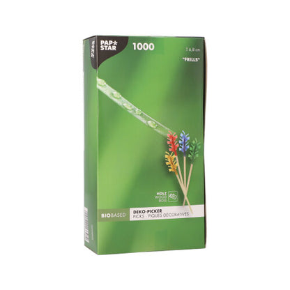 The PAPSTAR 1000 decoration pick 6.8 cm "Frills" from PAPSTAR GmbH is delivered in a green box with colorful frill skewers for table decoration and features packaging showing the skewers and a close-up of a dewdrop on grass.