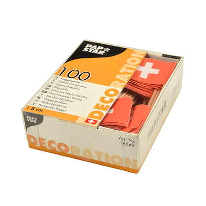 A pack of 100 PAPSTAR decoration picks from PAPSTAR GmbH – orange napkin bands with a white cross, perfect for stylishly set tables and buffets. The packaging features the brand name "PAPSTAR", the lettering "Decoration" and multilingual product information.
