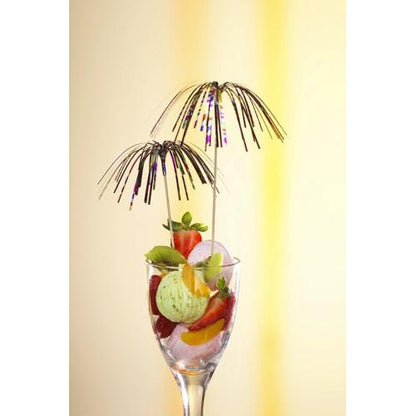 A glass dessert cup with green ice cream, strawberries, kiwi, and orange is topped with two high-quality PAPSTAR 100 decoration picks from PAPSTAR GmbH in firework design - ideal for a stylish presentation against a yellow gradient.