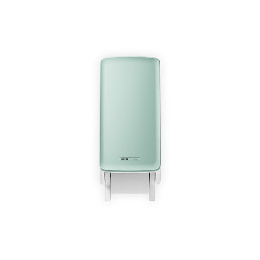 Das CWS PureLine Frontpanel für den Toilettenpapierspender von CWS, abgebildet in Mintgrün mit einem sichtbaren Blatt, das von unten herabhängt, wird an der Wand montiert und vor einem weißen Hintergrund fotografiert, um einen hygienischen Look zu erzielen.