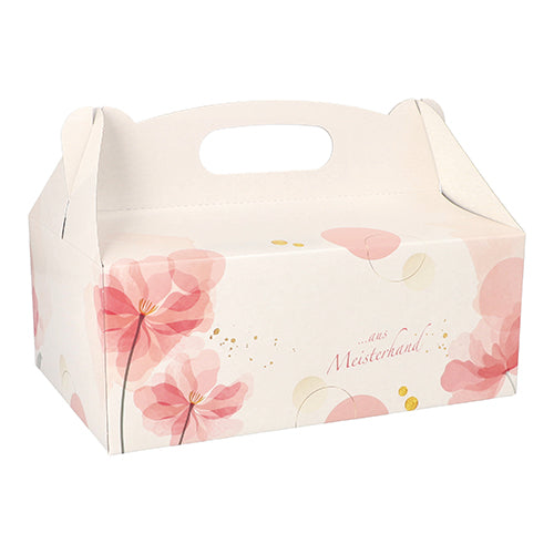 Die PAPSTAR 15 Gebäck-Kartons der PAPSTAR GmbH sind quadratische, rosafarbene Kartons mit Griffen, verziert mit floralen Mustern und goldenen Punkten – ideal für den Transport von Backwaren. Auf der Seite ist „Aus Meisterhand“ aufgedruckt.
