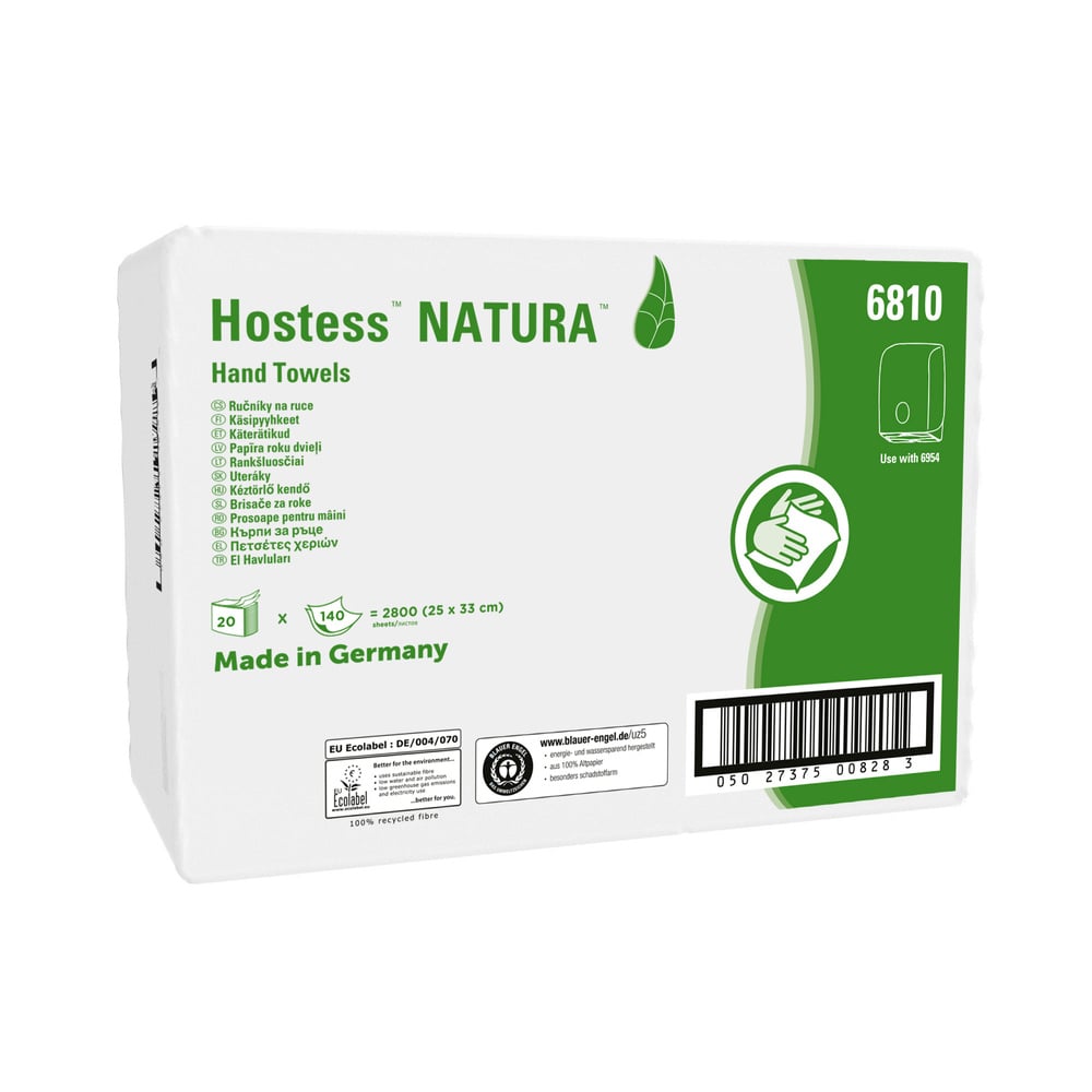 A rectangular white box of Kimberly-Clark Hostess™ NATURA™ C-fold towels (white, M), with green text and graphics, contains 20 packs with 140 sheets each per carton. Made in Germany, details and certifications are indicated on the packaging.