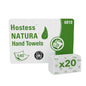 A pack of Hostess™ NATURA™ towels from Kimberly-Clark GmbH, C-fold, white, green and white packed with product name, hand and towel symbols, number 6810 and "x20" bundling - 20 packs with 140 sheets each per carton.