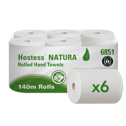 A carton containing six Hostess™ NATURA roll towels from Kimberly-Clark GmbH, each 140 m long roll in natural color, features an eco-friendly white and green packaging with product name, leaf logo, and a six-roll symbol - ideal for sustainable needs.