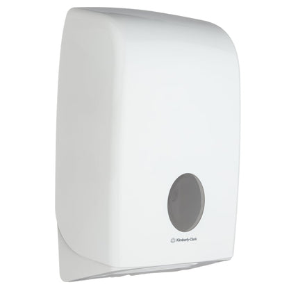 The Aquarius™ dispenser for folded towels - Interfold in white from Kimberly-Clark GmbH is a wall-mounted dispenser with a small round viewing window, hygienic design, and smooth, slightly curved shape. Holds and dispenses folded towels.
