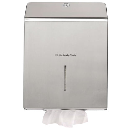 The Kimberly-Clark Professional™ stainless steel towel dispenser from Kimberly-Clark GmbH is wall-mounted and ensures hygienic hand drying with a visible white paper towel at the bottom dispensing compartment.
