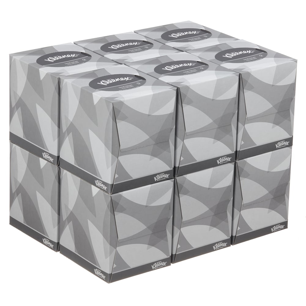Ein Stapel von neun Kleenex® Kosmetiktüchern - Würfel-Box / Weiß von Kimberly-Clark GmbH, angeordnet in drei Reihen und Spalten mit einem grauen geometrischen Design, ist ideal für die Gesichtspflege.