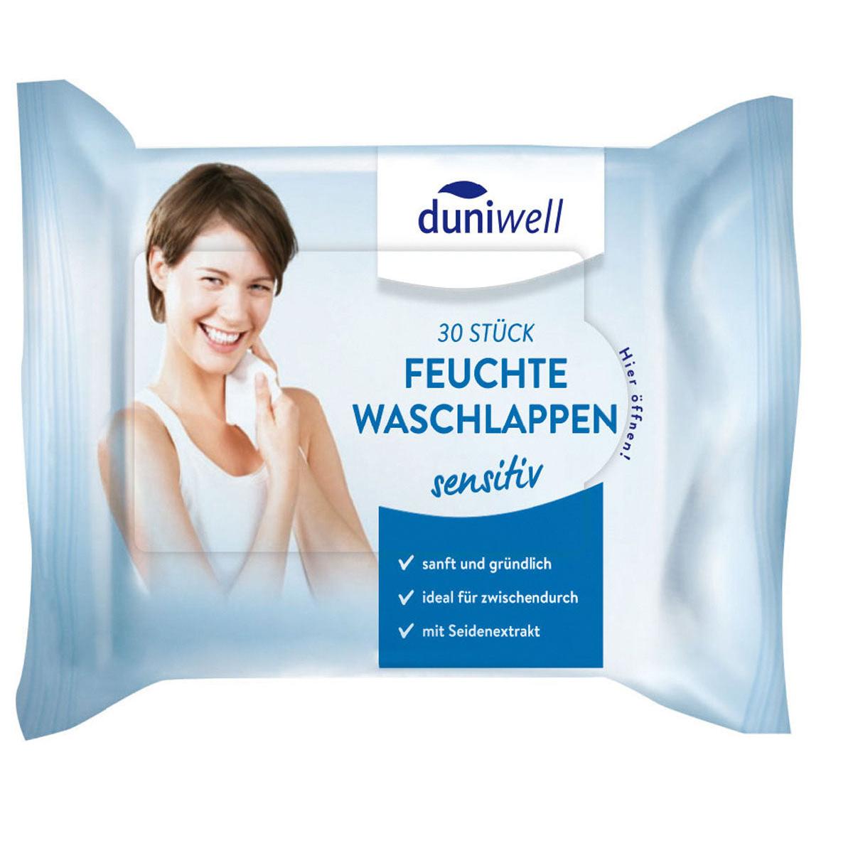 Eine Packung Duni GmbH feuchte Waschlappen, weiß 41035 (30 Stück), zeigt eine lächelnde Frau, die sich die Wange abwischt; auf der Verpackung steht "Reinigung und Pflege", sanftes, gründliches und seidenweiches Viskosegewebe auf Deutsch.