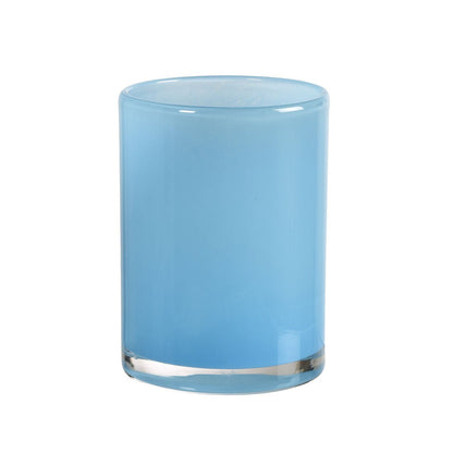 The Silky 115 x 85 mm LED candle holder glass from Duni GmbH is a small cylindrical glass with a smooth, solid light blue surface and clear bottom - perfect for creating an atmospheric lighting, depicted on a white background.