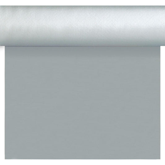 Eine Rolle Dunisilk-Tete a Tete 0,4x24m silber von Duni GmbH liegt teilweise ausgerollt auf einer Fläche, deren Oberkante sichtbar ist - ideal für elegante Tischdekoration. Die Packung enthält 1 Stück.