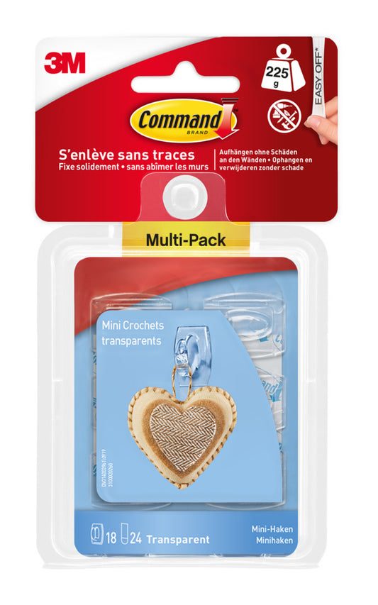 Der Command™ Mini-Haken, transparent (17006CLRFGN) von 3M Deutschland GmbH, kommt in einer Packung mit 18 Haken und 24 transparenten Streifen. Die Verpackung zeigt einen Haken, der ein herzförmiges Ornament hält.