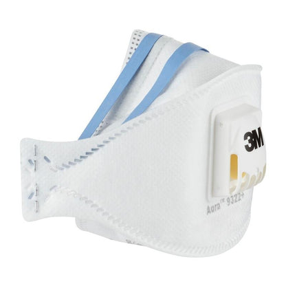 A 3M™ Aura™ Comfort Cool Flow™ Particulate Respirator 9322+, FFP2, with valve from 3M Deutschland GmbH, in white with blue headbands, lies on a white background. The mask has visible seams and printed product information on the side.