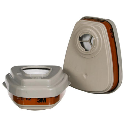 Pictured are two beige 3M™ Filter Set 6003-1, A2P3 filter cartridges with orange labels from 3M Deutschland GmbH - one standing, one lying down - for protection against organic vapors when used with compatible respirators.