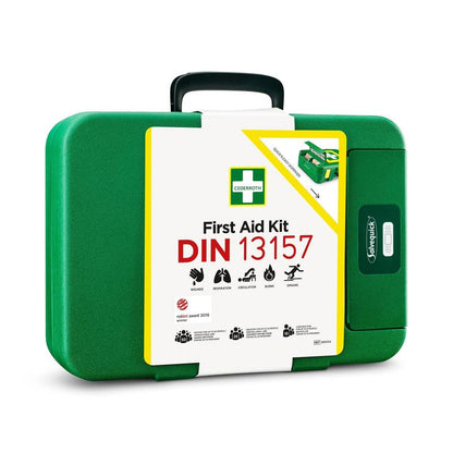 The green First Aid Kit DIN | Package (1 piece) made of plastic from Orkla Wound Care AB has a white label with the inscription "First Aid Kit DIN 13157", iconic symbols and is an essential emergency equipment.